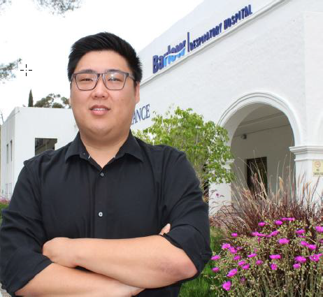 man in front of hospital